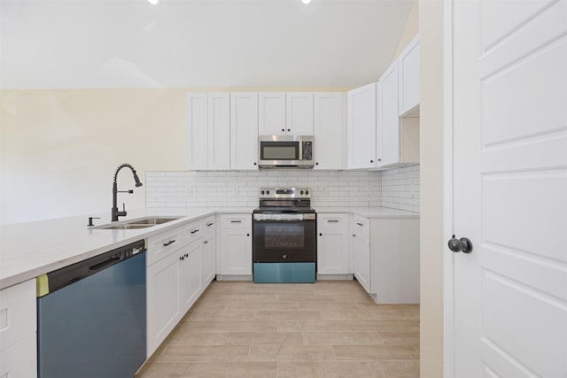 16960 W Dounreay, Montgomery, TX 77316 - kitchen with appliances with stainless steel finishes, tasteful backsplash, light countertops, light wood-style flooring, and white cabinetry