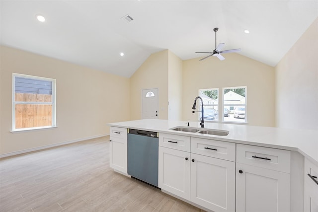 16960 W Dounreay, Montgomery, TX 77316 - kitchen with dishwasher, ceiling fan, vaulted ceiling, light countertops, and white cabinetry