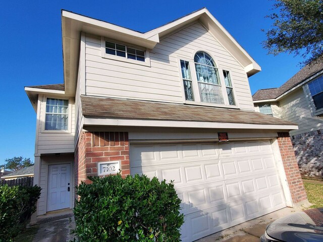7102 Biton Dr, Houston, TX 77083 - traditional-style home with brick siding and an attached garage