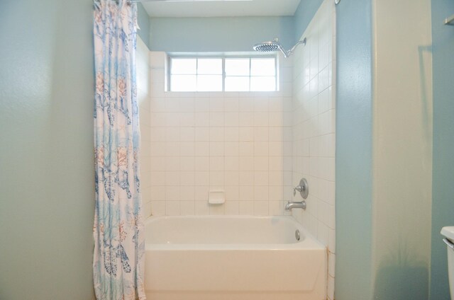 7102 Biton Dr, Houston, TX 77083 - bathroom featuring shower / tub combo with curtain