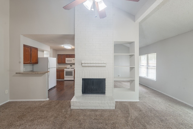 2302 Peaceful Valley Dr, Spring, TX 77373 - unfurnished living room featuring dark colored carpet, high vaulted ceiling, ceiling fan, baseboards, and a brick fireplace