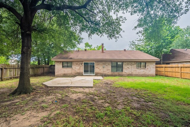 2302 Peaceful Valley Dr, Spring, TX 77373 - back of property with a patio area and brick siding