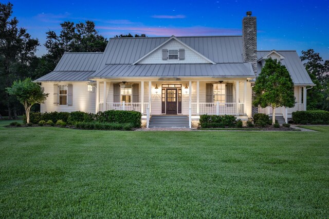 5926 Bit Pl, Baytown, TX 77523 - view of front of house featuring ceiling fan, covered porch, and a front lawn