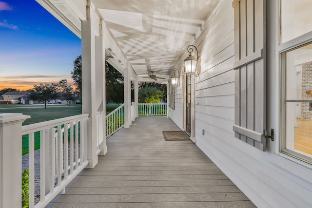5926 Bit Pl, Baytown, TX 77523 - deck at dusk with a porch and ceiling fan