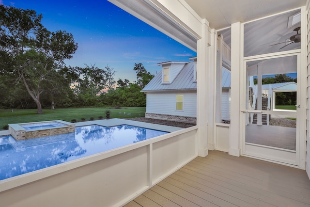 5926 Bit Pl, Baytown, TX 77523 - view of swimming pool featuring a pool with connected hot tub, a deck, and a lawn