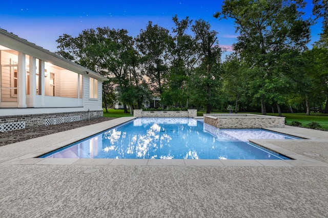 5926 Bit Pl, Baytown, TX 77523 - view of pool with a pool with connected hot tub, view of wooded area, and a patio area