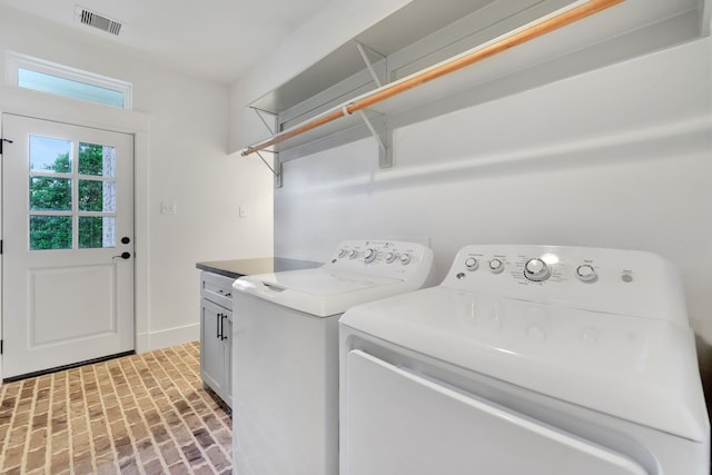 5926 Bit Pl, Baytown, TX 77523 - laundry room with brick patterned flooring, cabinet space, washing machine and dryer, and baseboards