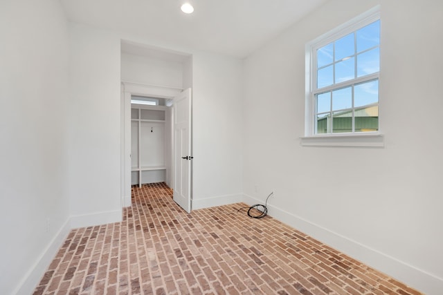 5926 Bit Pl, Baytown, TX 77523 - unfurnished bedroom featuring baseboards, brick patterned floors, and recessed lighting