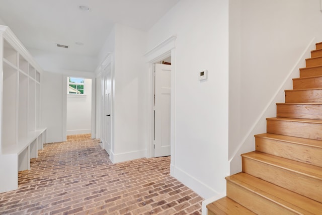 5926 Bit Pl, Baytown, TX 77523 - mudroom featuring brick floors and baseboards