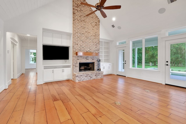5926 Bit Pl, Baytown, TX 77523 - unfurnished living room with high vaulted ceiling, ceiling fan, a fireplace, built in features, and attic access