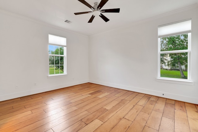 5926 Bit Pl, Baytown, TX 77523 - spare room with crown molding, baseboards, a ceiling fan, and light wood-style floors