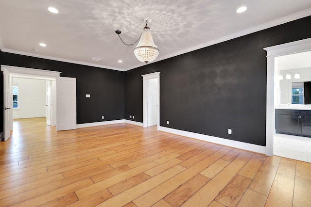 5926 Bit Pl, Baytown, TX 77523 - spare room featuring a chandelier, light wood-style flooring, recessed lighting, crown molding, and baseboards