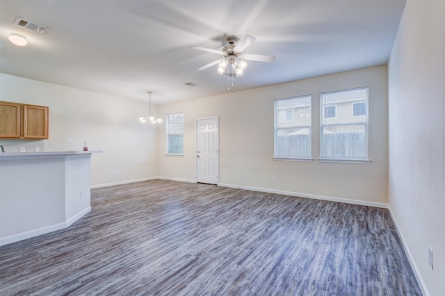 6106 Yorkglen Manor Ln, Houston, TX 77084 - unfurnished living room featuring a chandelier, wood finished floors, and a ceiling fan