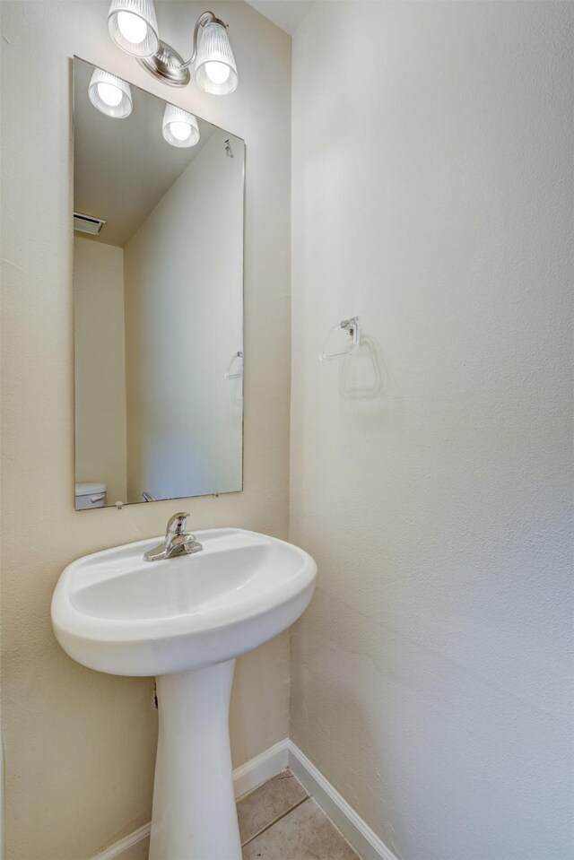 6106 Yorkglen Manor Ln, Houston, TX 77084 - bathroom with baseboards and tile patterned flooring