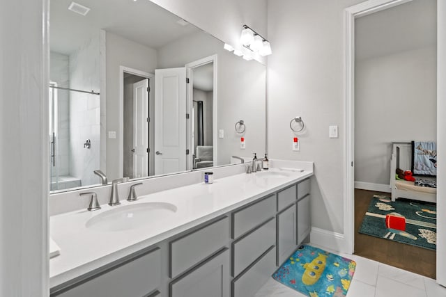 5318 Abington Creek Ln, Sugar Land, TX 77479 - bathroom with double vanity, a shower, tile patterned floors, and baseboards