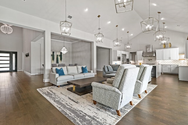 5318 Abington Creek Ln, Sugar Land, TX 77479 - living area featuring high vaulted ceiling, a chandelier, dark wood finished floors, and recessed lighting