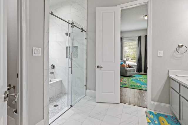 5318 Abington Creek Ln, Sugar Land, TX 77479 - bathroom featuring a stall shower, vanity, marble finish floors, and baseboards