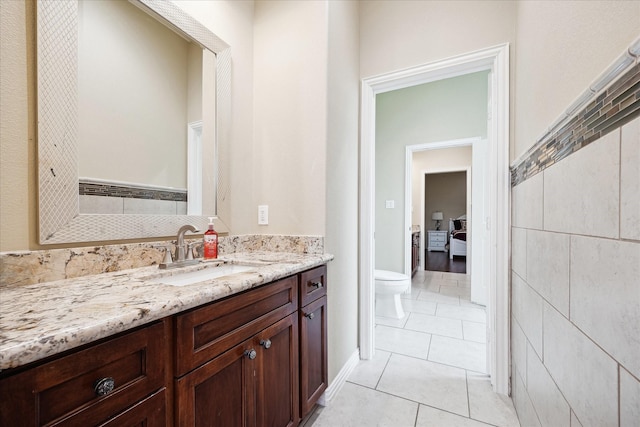 8917 Hawk Rd, Pearland, TX 77584 - bathroom with toilet, vanity, and tile patterned floors