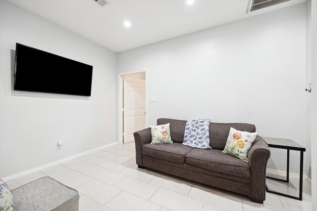 8917 Hawk Rd, Pearland, TX 77584 - living room featuring baseboards, recessed lighting, and light tile patterned floors