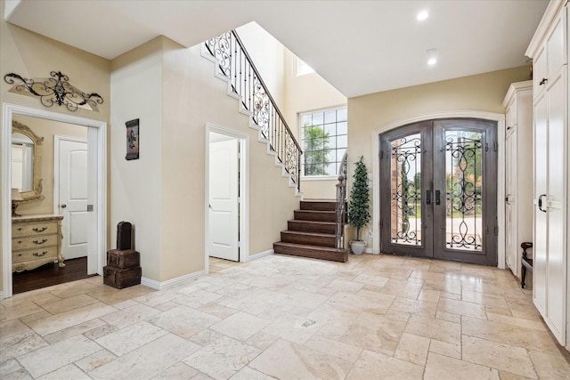 8917 Hawk Rd, Pearland, TX 77584 - foyer entrance featuring stone tile floors, french doors, stairway, baseboards, and recessed lighting