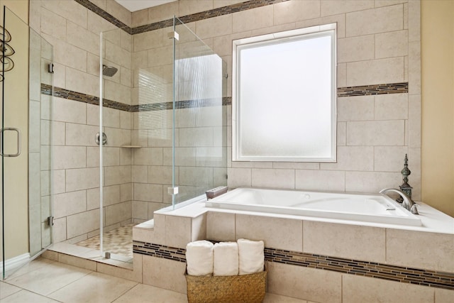 8917 Hawk Rd, Pearland, TX 77584 - bathroom with a bath, a stall shower, and tile patterned floors