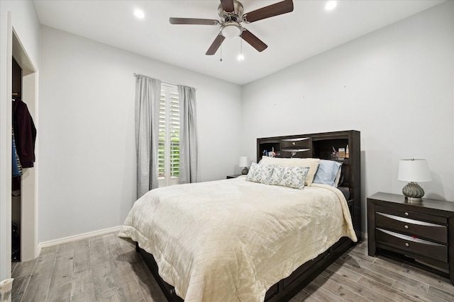 8917 Hawk Rd, Pearland, TX 77584 - bedroom with wood finished floors, recessed lighting, baseboards, and a ceiling fan