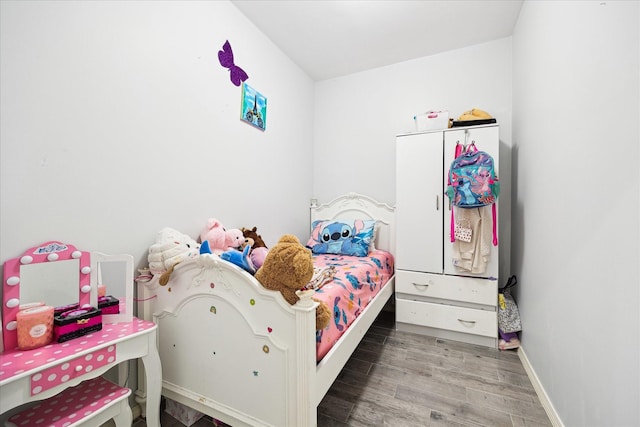 8917 Hawk Rd, Pearland, TX 77584 - bedroom featuring wood finished floors