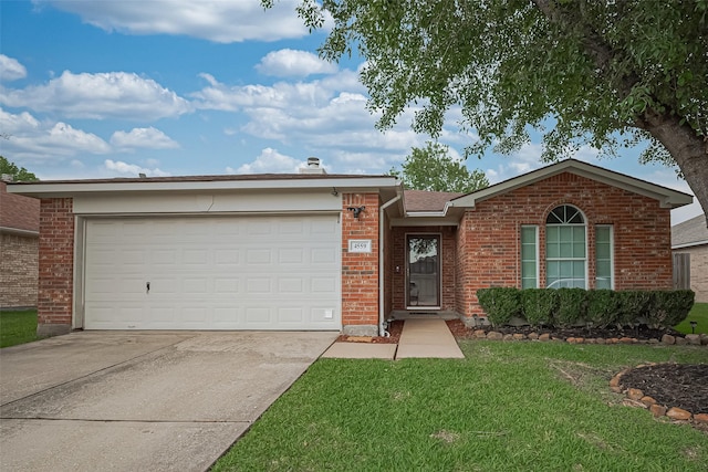 4559 Taino Dr, Baytown, TX 77521 - ranch-style home with brick siding, driveway, a garage, and a front lawn