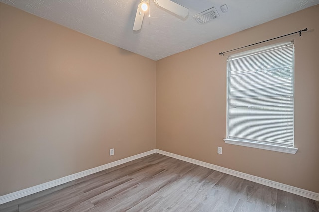 4559 Taino Dr, Baytown, TX 77521 - empty room featuring wood finished floors, baseboards, and a ceiling fan