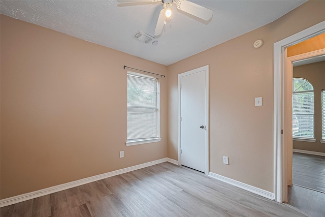 4559 Taino Dr, Baytown, TX 77521 - unfurnished bedroom with wood finished floors, baseboards, and ceiling fan