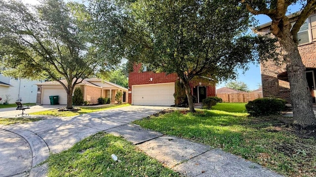 2911 Ribbon Creek Way, Spring, TX 77389 - view of front of home featuring concrete driveway, an attached garage, and brick siding