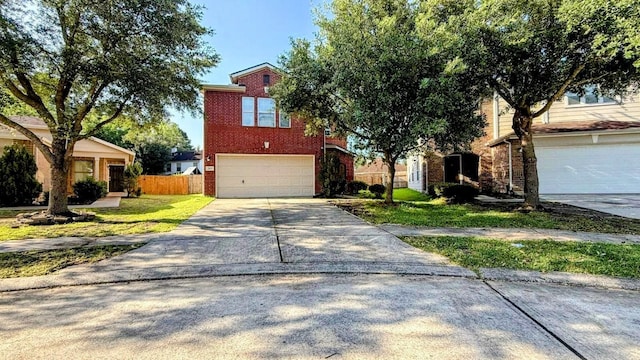 2911 Ribbon Creek Way, Spring, TX 77389 - view of front of house featuring concrete driveway, a garage, and brick siding