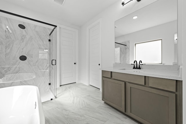 30415 Bermuda Hallow Bnd, Brookshire, TX 77423 - full bathroom featuring a marble finish shower, marble look tile flooring, a soaking tub, vanity, and recessed lighting