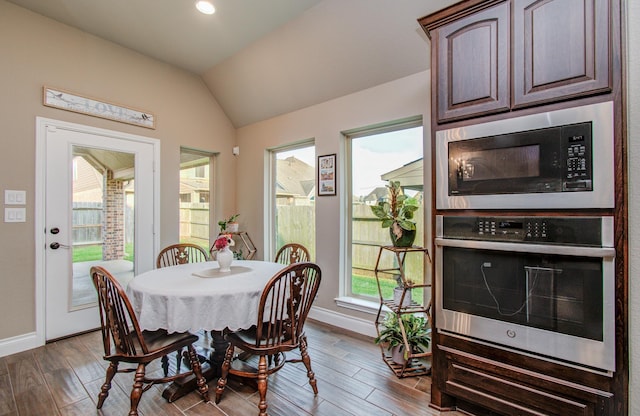 2335 Mayfield Trail Ct, League City, TX 77573 - dining space featuring vaulted ceiling, baseboards, dark wood finished floors, and recessed lighting