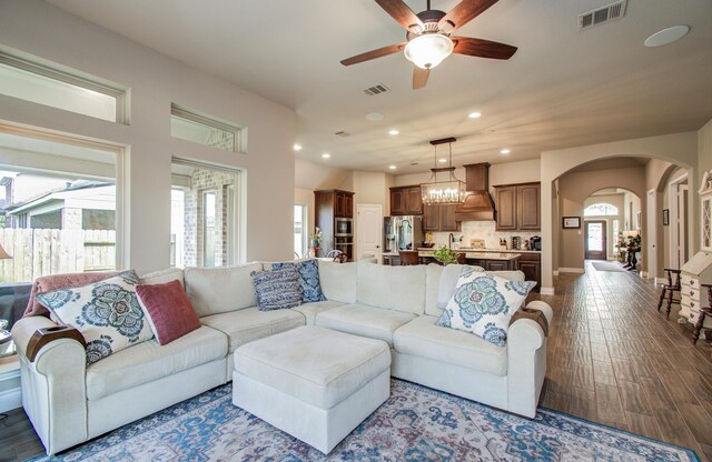 2335 Mayfield Trail Ct, League City, TX 77573 - living room with ceiling fan, arched walkways, dark wood-style flooring, recessed lighting, and baseboards