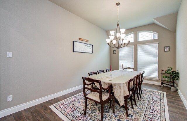 2335 Mayfield Trail Ct, League City, TX 77573 - dining space featuring a chandelier, dark wood-style flooring, baseboards, and vaulted ceiling