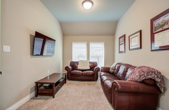 2335 Mayfield Trail Ct, League City, TX 77573 - living area featuring light colored carpet, vaulted ceiling, and baseboards