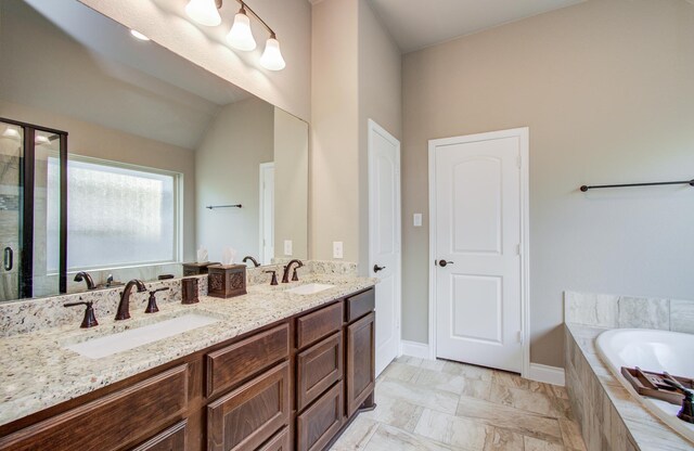 2335 Mayfield Trail Ct, League City, TX 77573 - bathroom with a garden tub, double vanity, a shower stall, and vaulted ceiling