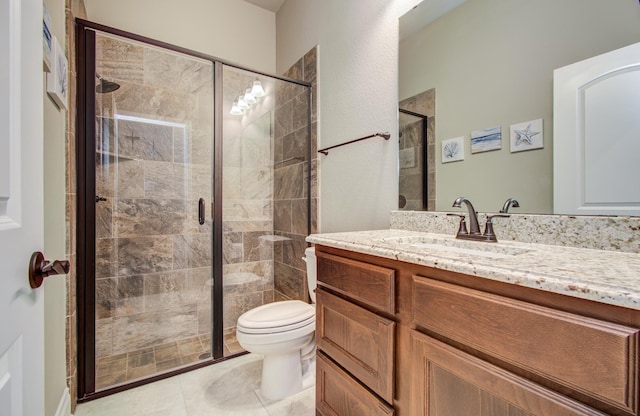 2335 Mayfield Trail Ct, League City, TX 77573 - full bathroom with vanity, a stall shower, toilet, and tile patterned floors