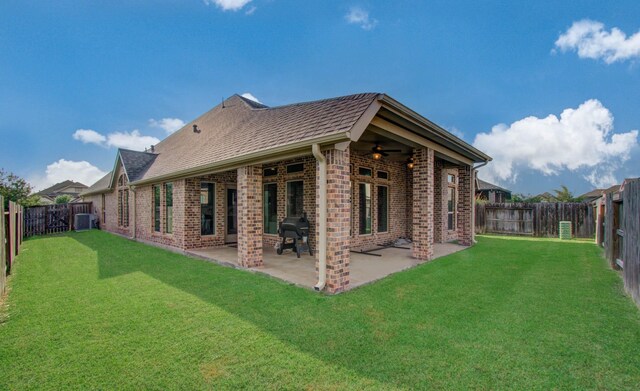 2335 Mayfield Trail Ct, League City, TX 77573 - back of property with brick siding, ceiling fan, central AC unit, and a patio area
