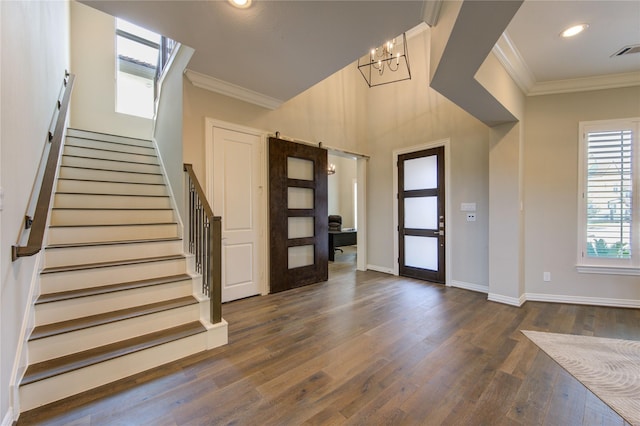 13706 Northwood Meadow Cir, Houston, TX 77077 - foyer entrance with crown molding, a chandelier, stairway, wood finished floors, and baseboards