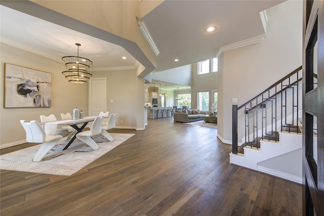 13706 Northwood Meadow Cir, Houston, TX 77077 - dining space featuring crown molding, stairway, dark wood finished floors, baseboards, and a chandelier