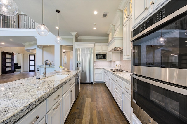 13706 Northwood Meadow Cir, Houston, TX 77077 - kitchen featuring a sink, built in appliances, ornamental molding, white cabinets, and light stone counters