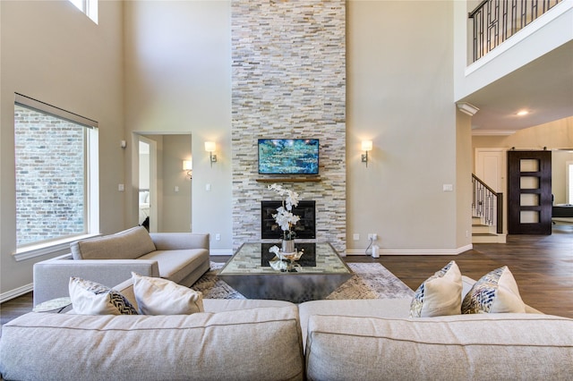 13706 Northwood Meadow Cir, Houston, TX 77077 - living area featuring a high ceiling, plenty of natural light, stairway, baseboards, and wood finished floors