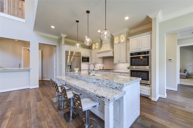 13706 Northwood Meadow Cir, Houston, TX 77077 - kitchen featuring a sink, stainless steel appliances, custom range hood, ornamental molding, and backsplash