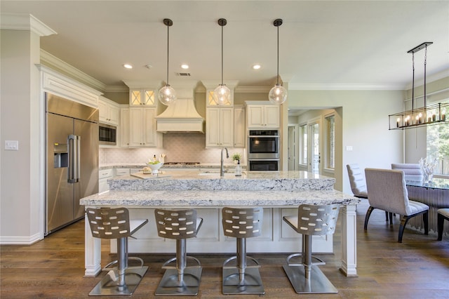 13706 Northwood Meadow Cir, Houston, TX 77077 - kitchen featuring built in appliances, a sink, backsplash, a breakfast bar, and ornamental molding