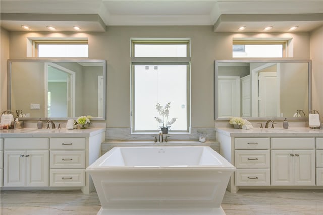 13706 Northwood Meadow Cir, Houston, TX 77077 - full bath featuring a freestanding bath, crown molding, two vanities, healthy amount of natural light, and recessed lighting