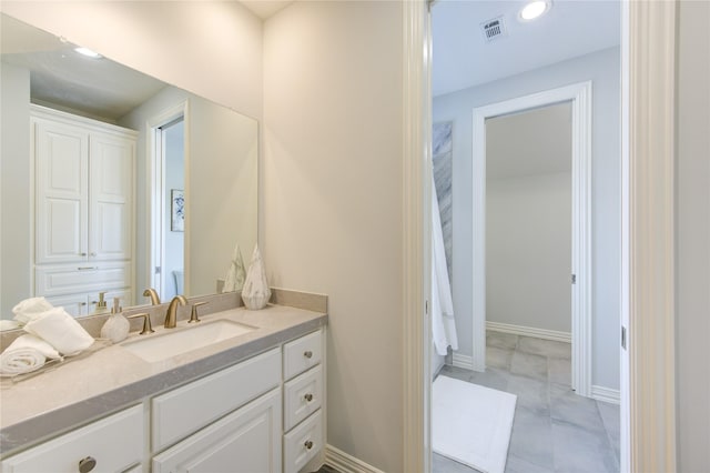 13706 Northwood Meadow Cir, Houston, TX 77077 - bathroom featuring vanity, baseboards, and recessed lighting