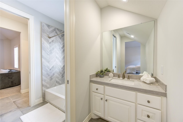 13706 Northwood Meadow Cir, Houston, TX 77077 - full bath with connected bathroom, vanity, lofted ceiling, washtub / shower combination, and baseboards