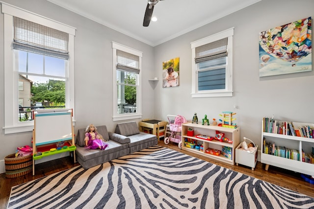 728 Allston St, Houston, TX 77007 - game room with wood finished floors, ornamental molding, and a ceiling fan
